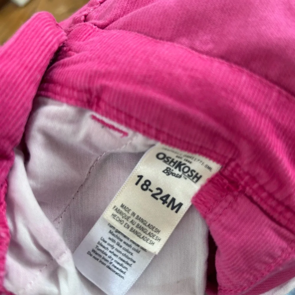 Pink OshKosh B'gosh corduroy overalls with floral lining on cuffs toddler girls
